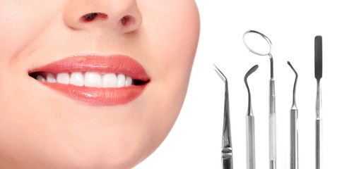 Teeth care concept. Healthy teeth and dental tools.