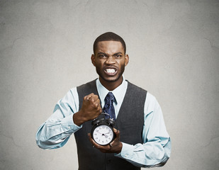 Portrait demanding corporate boss holding clock screaming