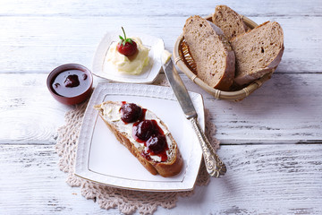 Fresh toast with homemade butter and strawberry jam