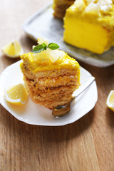 Tasty lemon dessert on wooden table