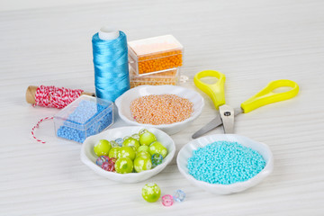 Materials for manufacture of jewelry on table close-up