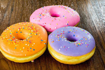 group of donuts on wood