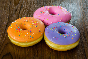 group of donuts on wood