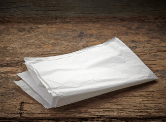 white wrapping paper on wooden table
