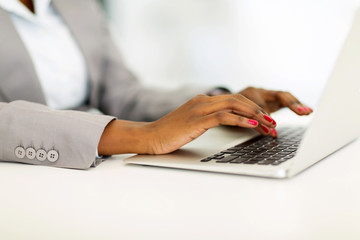 african businesswoman hands working on laptop