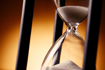 Sand running through an egg timer or hourglass