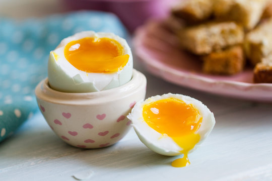 Opened boiled blue duck egg with soft yolk