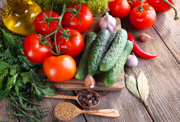 Fresh vegetables with herbs and spices on table, close-up