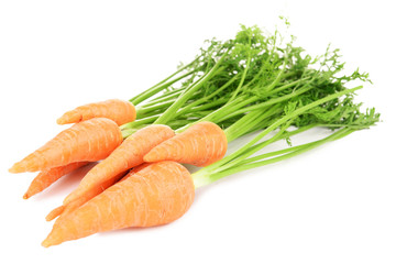 Fresh carrot with leaves isolated on white