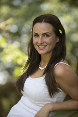 Fototapeta premium Outdoor portrait of young woman smiling