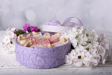 Present box with sweets and flowers