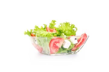 Salat with tomato and cheese in a bowl