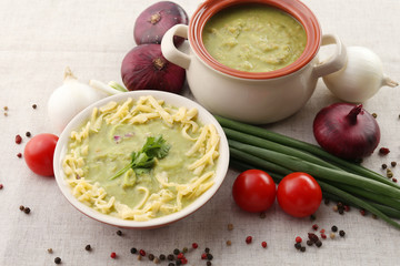 Leek soup on table, close up