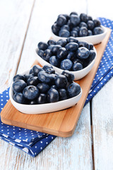 Delicious blueberries on table close-up