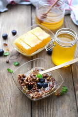 Fresh snack with honey on wooden table
