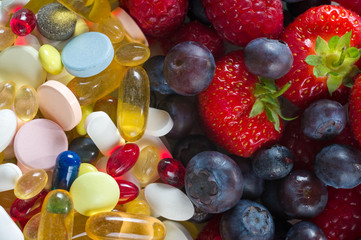 Fototapeta na wymiar Healthy lifestyle, Fruit and pills, vitamin supplements