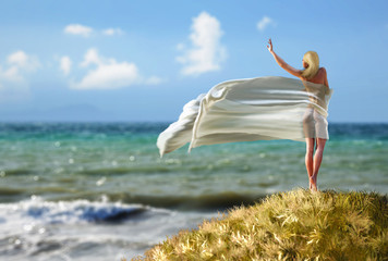 woman with a tissue on a beach