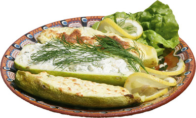 Roasted vegetables on a rustic plate. Baked vegetable marrow.