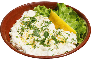 Fresh and tasty salad with milk, cucumbers and herbs