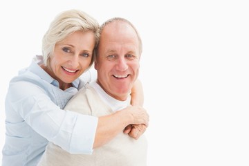 Happy mature couple smiling at camera