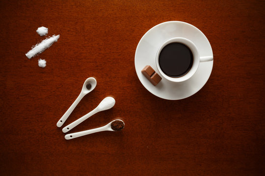 cup of coffee with ingredients and little dessert chocolate, kca