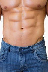 Naklejka premium Mid section of a shirtless muscular man