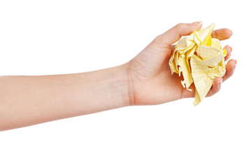 Female hand holding a crumpled paper