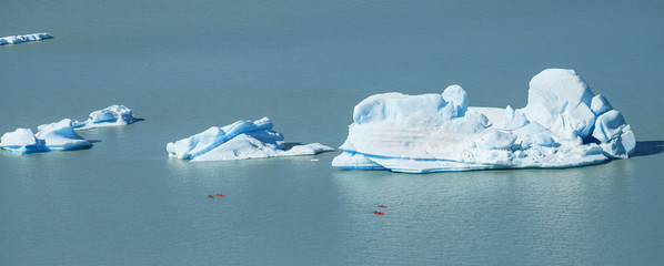 Fototapeta na wymiar Beautiful Iceberg and canoes, Patagonia, Chile.