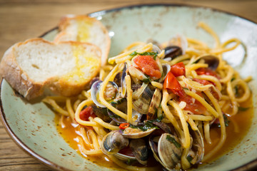 Homemade pasta with seafood and cherry tomatoes