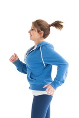 Side view of a young woman running