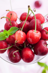 Fresh wet cherry in a glass