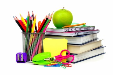 Group of school supplies and books over a white background