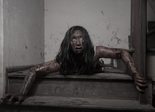 Zombie girl in haunted house scary