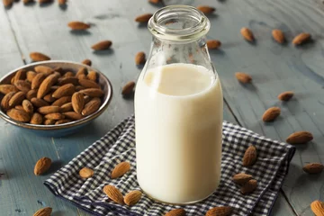 Fotobehang Organic White Almond Milk © Brent Hofacker