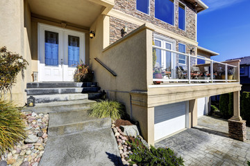 House exterior. View of entrance porch and walkout deck