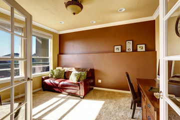 Office room with red leather couch