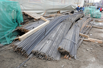 Bundles of long steel reinforcement on the building site