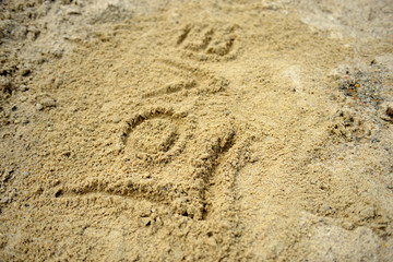 Word love written in the sand