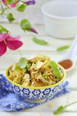 pilaf with chicken, peas and almonds