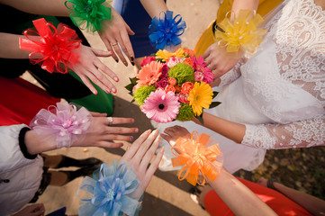 Hands and bridal bouquet.