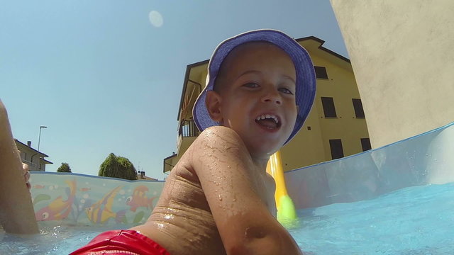 Little Boy Having Fun on Small Swimming Pool