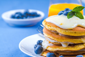 Pancakes with vanilla sauce and blueberry
