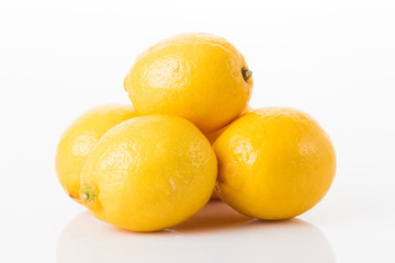ripe lemons on a white background 