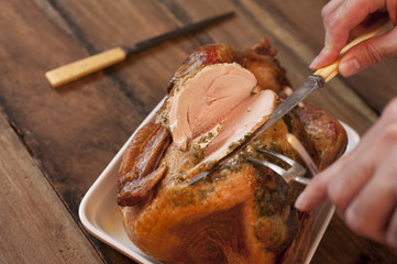 Man carving a roast turkey