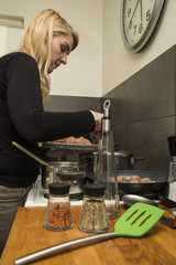 Housewife cooking dinner