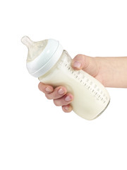 Mother prepares baby milk formula.