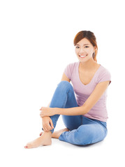 smiling beautiful young woman sitting on the floor