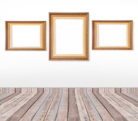 Set of gold vintage picture frames on the wall