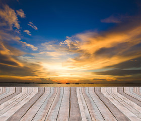 Naklejka na ściany i meble Wood plank as a pier or deck on blue sea water and sky