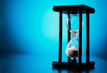 Egg timer or hourglass on a blue background